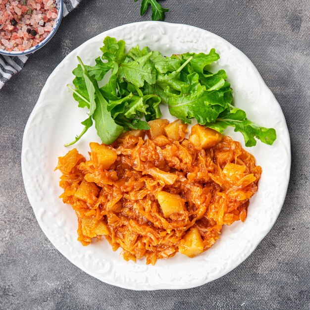 stewed cabbage with vegetables healthy meal food snack on the table copy space food background