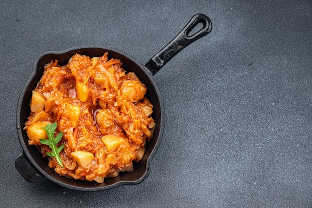 stewed cabbage with vegetables healthy meal food snack on the table copy space food background