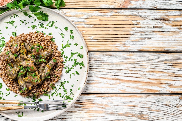 Stewed chicken stomachs with vegetables and buckwheat