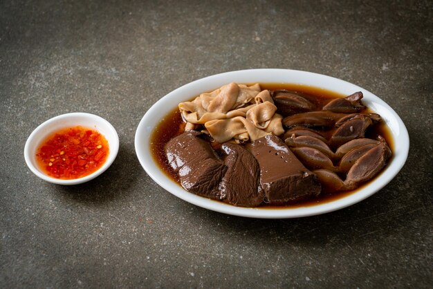 stewed duck offal in brown soup - Asian food style