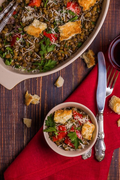 Stewed lentils with bacon, peppers and croutons