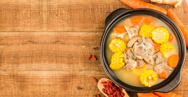 Stewed mutton soup with corn and carrot