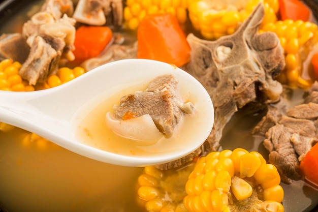 Stewed mutton soup with corn and carrot