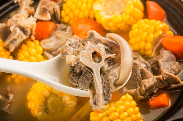 Stewed mutton soup with corn and carrot