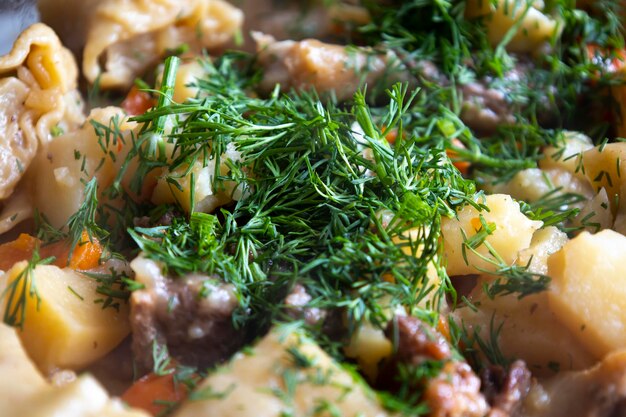 Stewed potatoes with meat and herbs