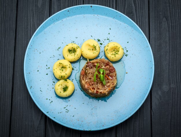 Stewed sauerkraut with sausage on a plate