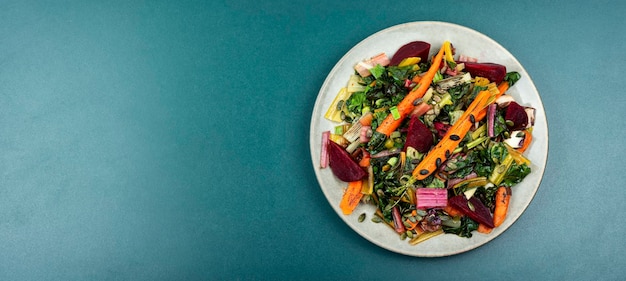 Stewed vegetables and chard leaves copy space