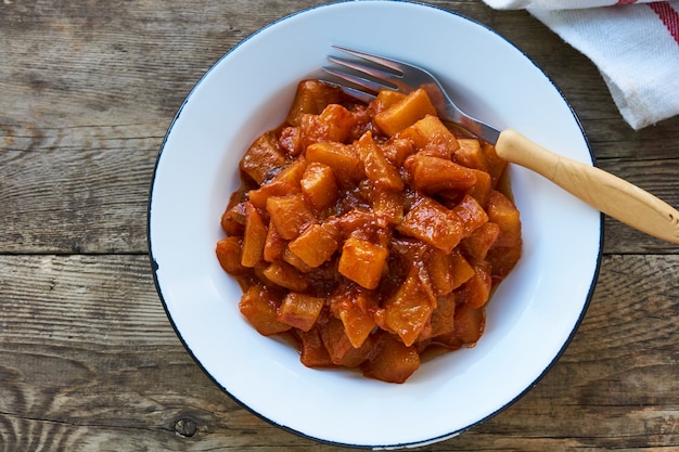 Stewed zucchini with onions and tomato sauce in a bowl