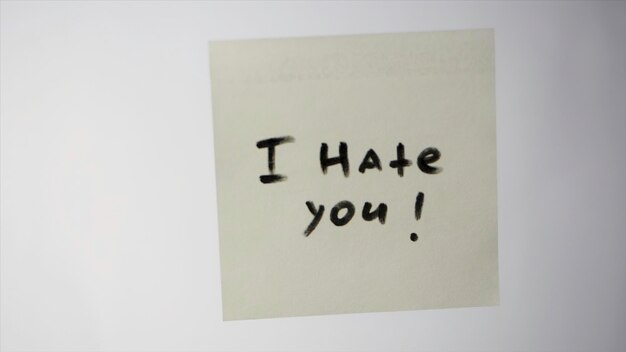 sticker with the words i hate you i hate you message post card