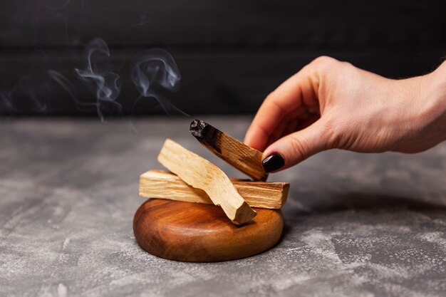 Sticks of the sacred palo santo tree streaming with aroma incense