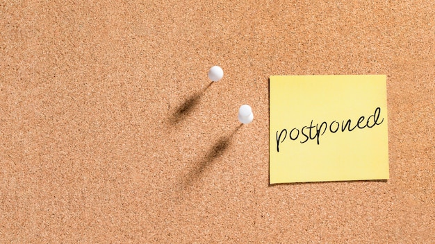 Sticky note with postponed