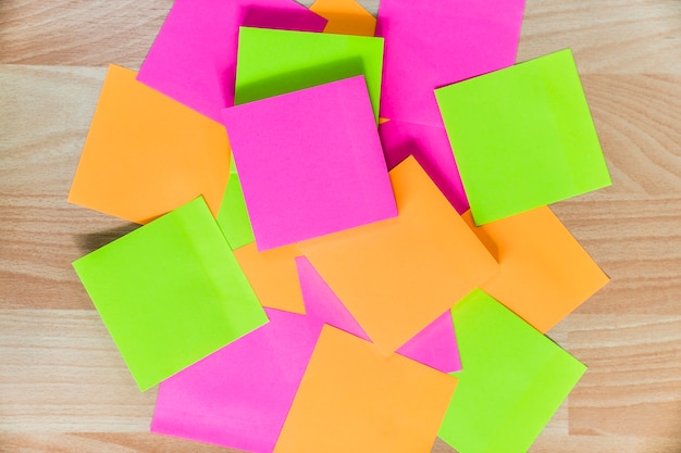 Photo sticky notes in different colors on floor