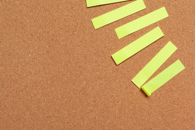 Sticky notes with copy space on cork board