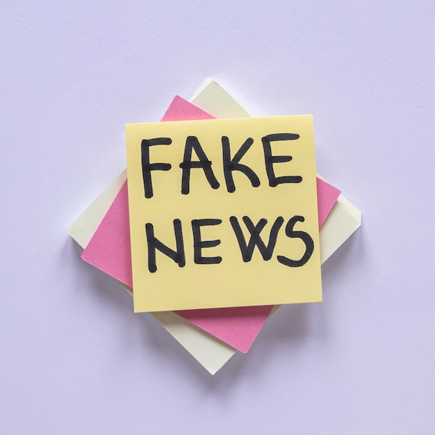 Photo sticky notes with fake news message