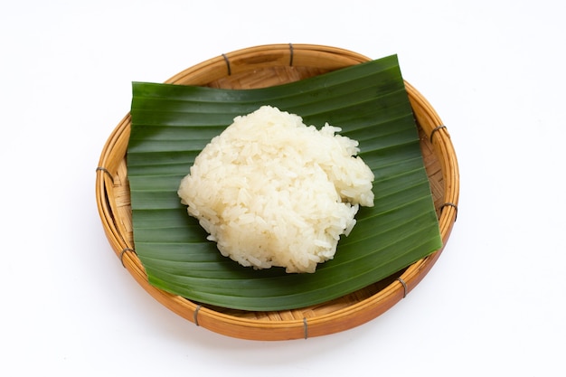 Sticky rice in bamboo basket on white background.