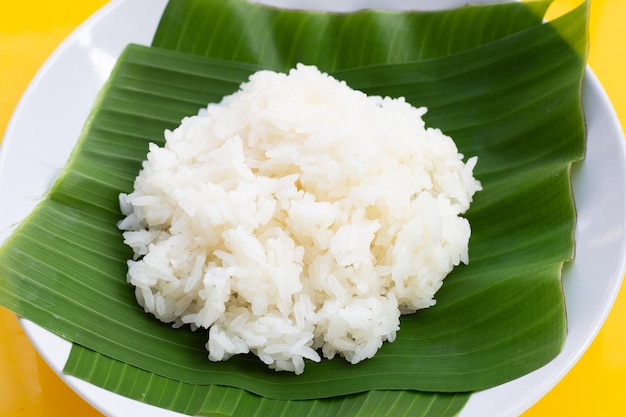 Sticky rice on banana leaf  in plate