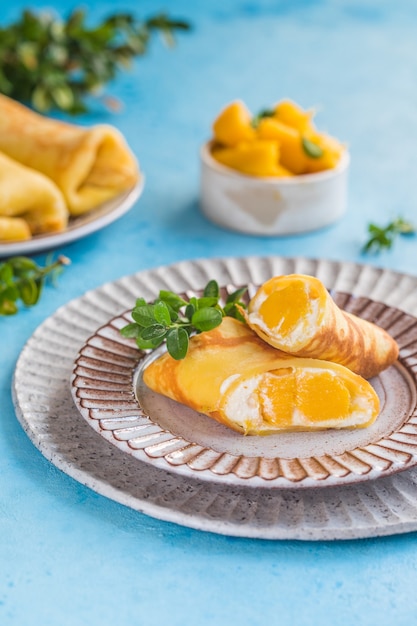 Sticky rice and mango crepe cake roll , 
Hong Kong , Thai food style in summer