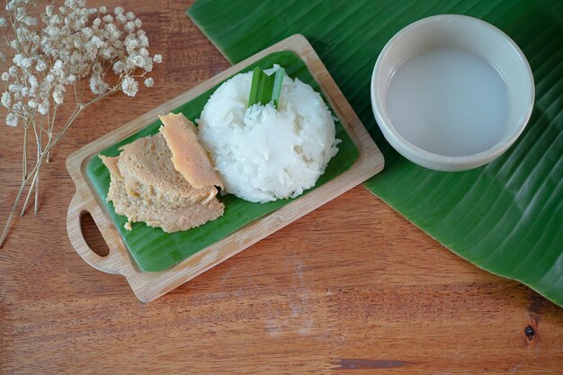 Sticky Rice with Egg Custard Thai desserts on a wooden table