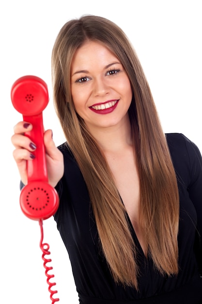 Stijlvolle vrouw met een rode telefoon