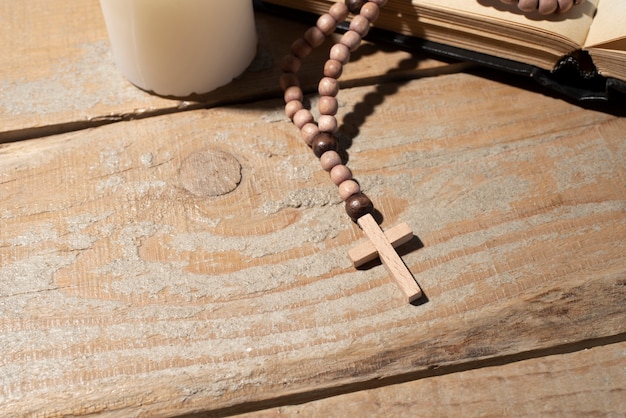 Still life of crucifix with book