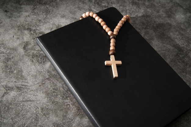 Still life of crucifix with book