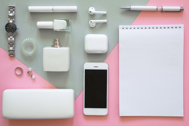 Still life of fashion woman, objects on pink and grey