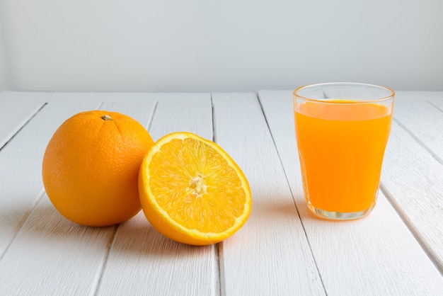 Still Life Fresh Orange Fruit, Orange Juice on Vintage White Wood Table