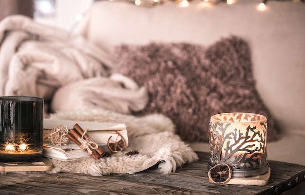 still life home atmosphere in the interior with candles and a book