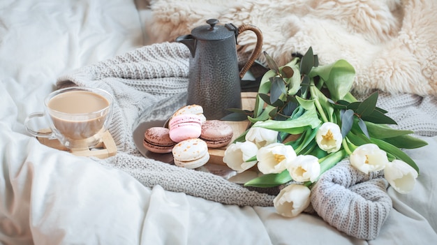 Still-life morning breakfast with coffee and macaroon