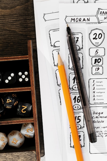 Photo still life of objects with role playing game sheet