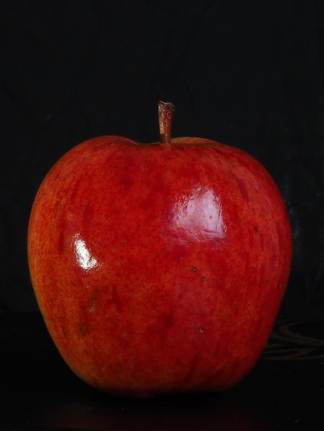 Still life Red apple on a black background