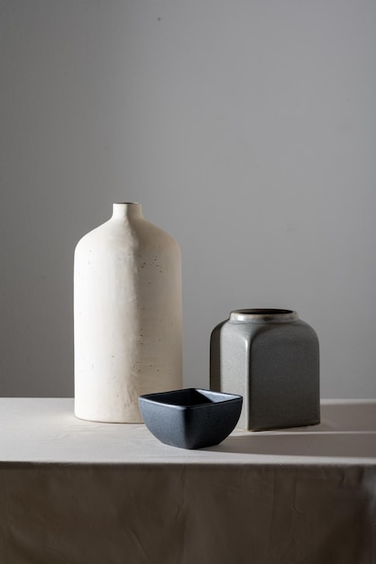 Photo still life vase made of white matte clay and vases of various shapes