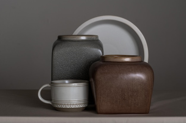 Photo still life vase made of white matte clay and vases of various shapes