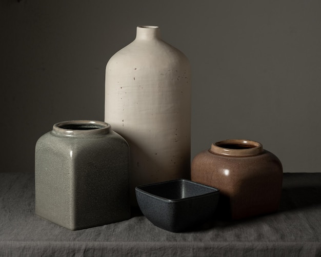 Photo still life vase made of white matte clay and vases of various shapes