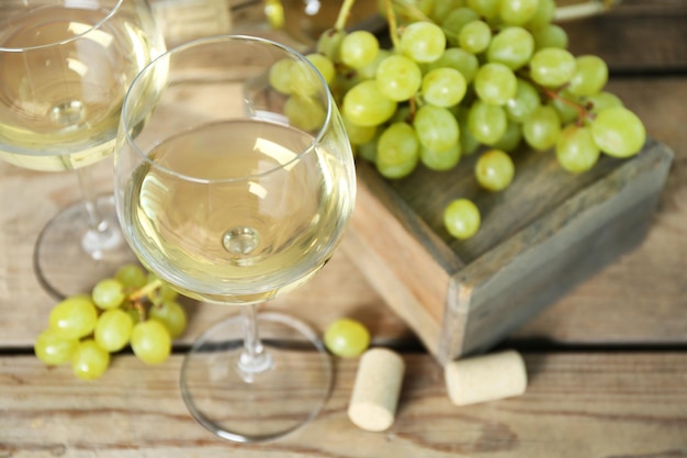 Still life of wine and bread on light background