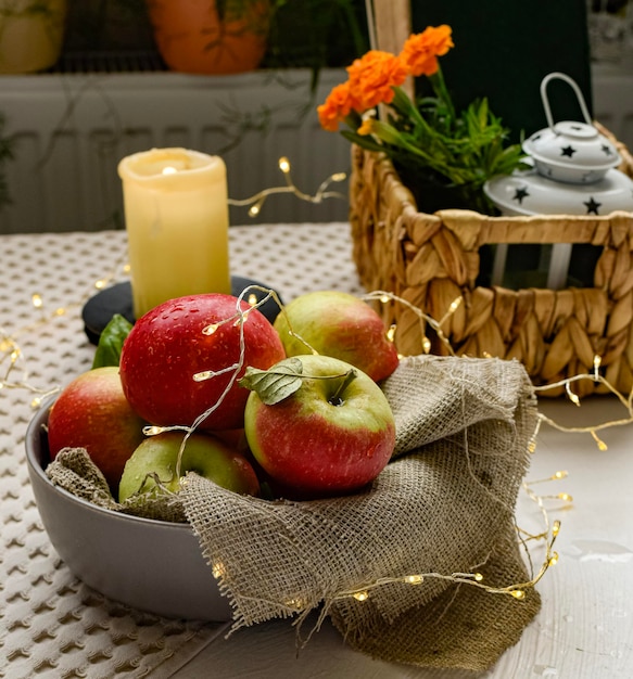 still life with apples in basket on table