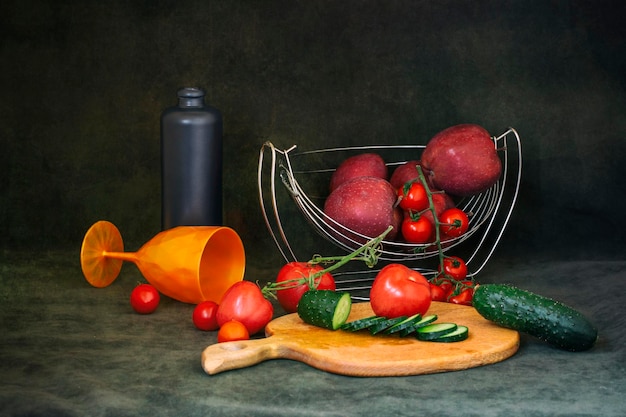 Still life with apples tomatoes and cucumbers