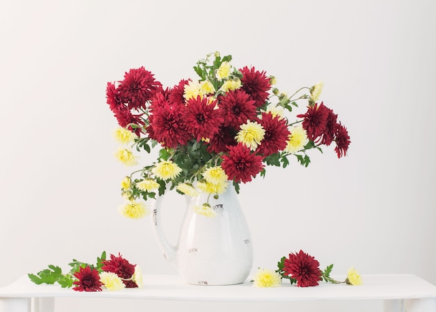 Still life with chrysanthemums on white background