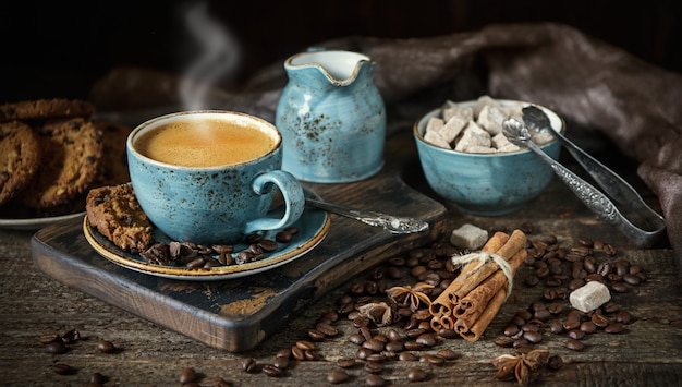 Still life with a Cup of fragrant hot coffee on a wooden table close up