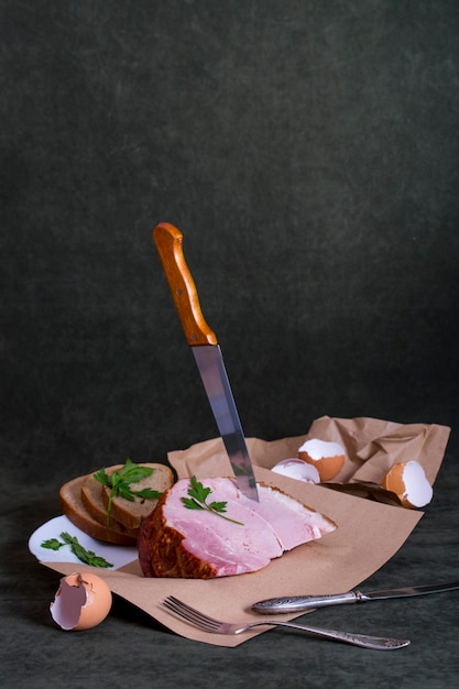 Still life with fresh pork ham on the table