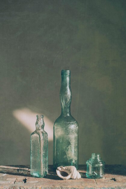 Photo still life with glass bottles of various shapes art photography
