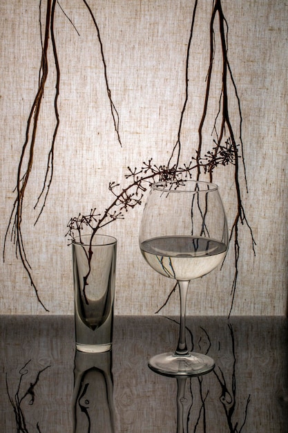 Still life with glass objects and a branchs