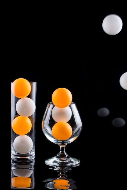 Still life with glasses, balls and reflection