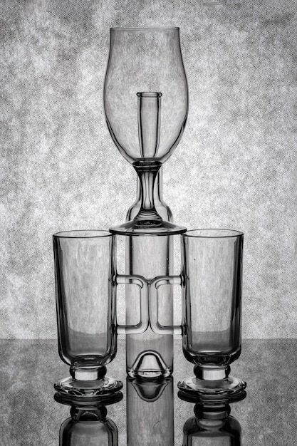Photo still life with glassware on a reflective surface