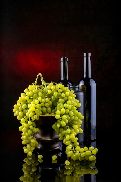 Still life with grapes and wine in glasses