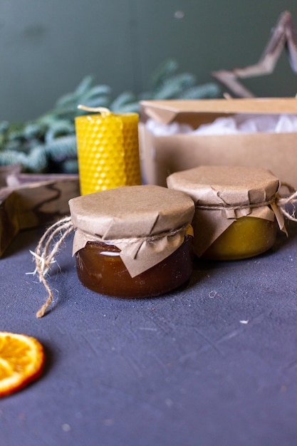 Photo still life with a jar of honey on a dark background