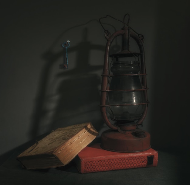 Still life with a kerosene lamp and books. Retro. Vintage