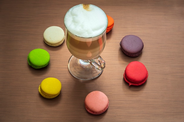 Still life with latte cup and macaroons