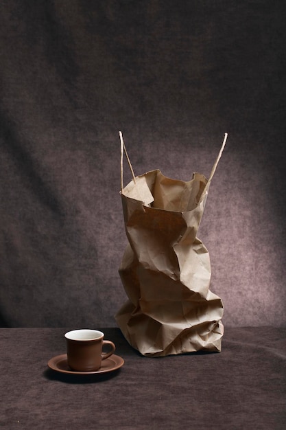 Still life with a paper bag and a coffee cup