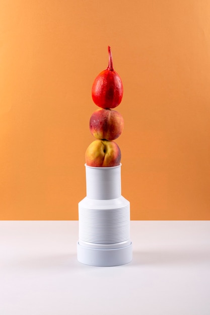 Still life with peaches and red pumpkin